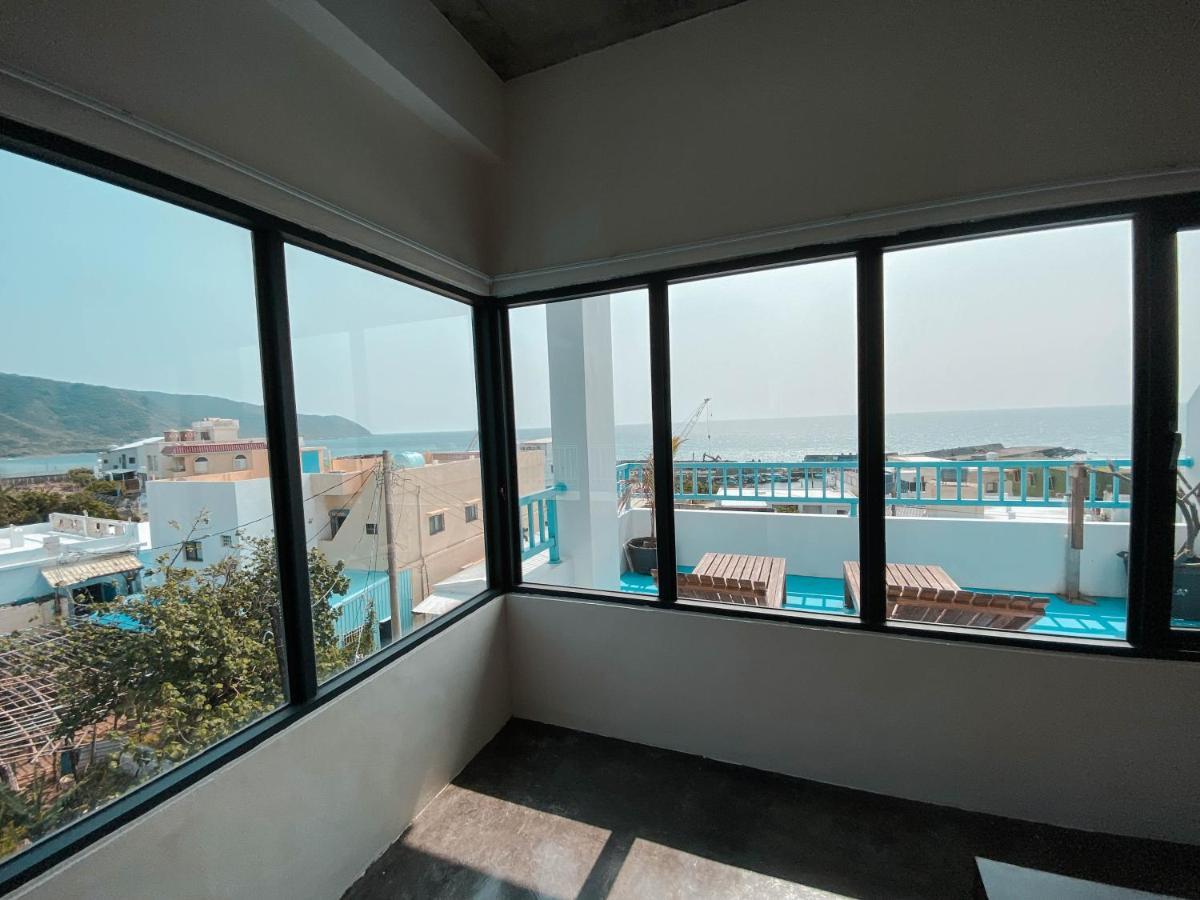 Lugo Hotel Manzhou Bagian luar foto